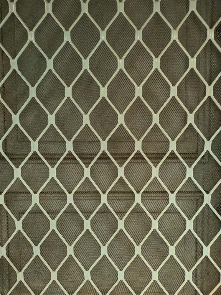 Closeup On A White Screen Door